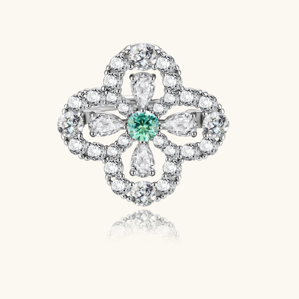 Sterling silver adjustable ring featuring four-leaf clover design with green center moissanite and clear accent stones