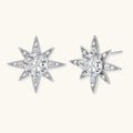 Sterling silver star-shaped stud earrings with brilliant moissanite center stones and pavé details on neutral background.