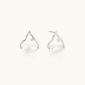 Silver mountain outline studs with baroque pearl and diamond accent on white background