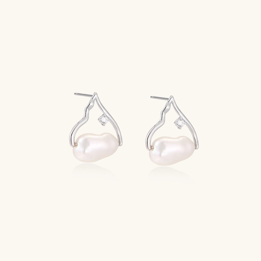 Silver mountain outline studs with baroque pearl and diamond accent on white background