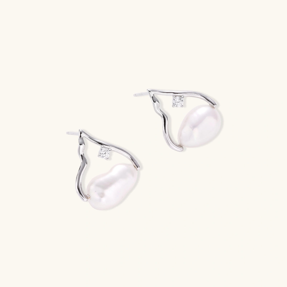 Silver mountain outline studs with baroque pearl and diamond accent on white background