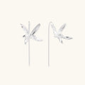Delicate sterling silver dragonfly earrings with textured wings and curved threader hooks on white background